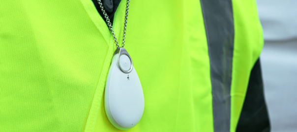 lone worker in hi-vis jacket wearing a Lone Alarm around their neck