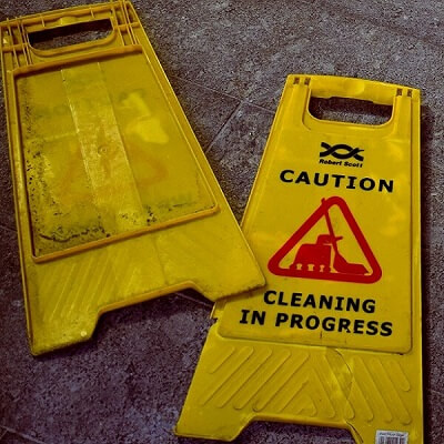 broken wet floor sign