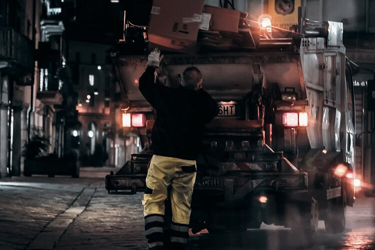 refuse collector working on night shift